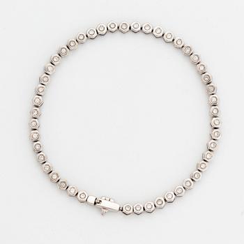 Tennisarmband, vitguld och briljantslipade diamanter.