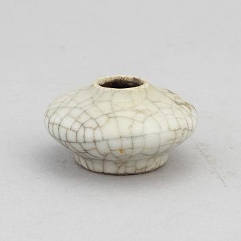 A Chinese celadon glazed lotus leaf shaped bowl, late Qing dynasty, and a ge-glazed brush washer, possibly 20 century.