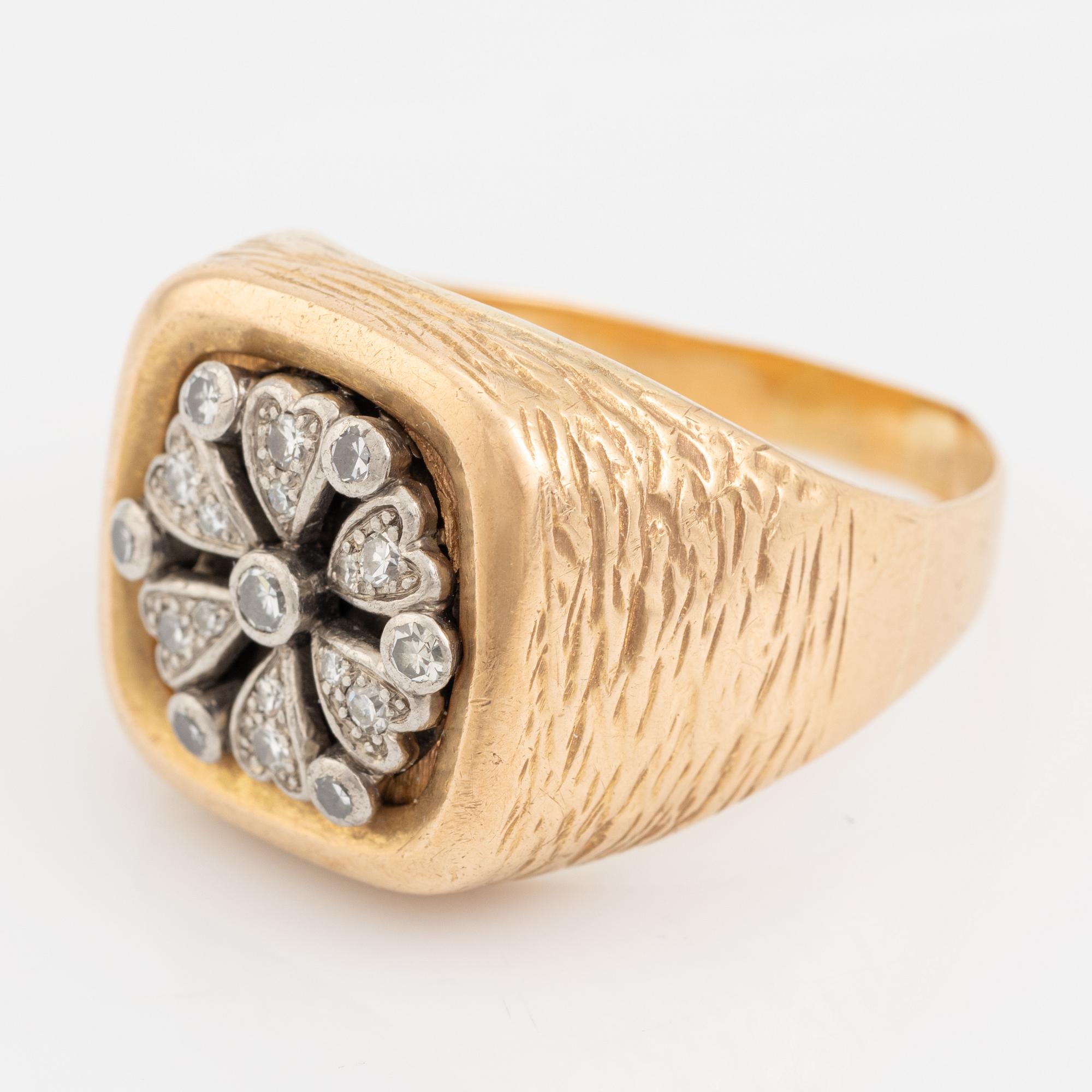 An 18K gold ring set with eight-cut diamonds.