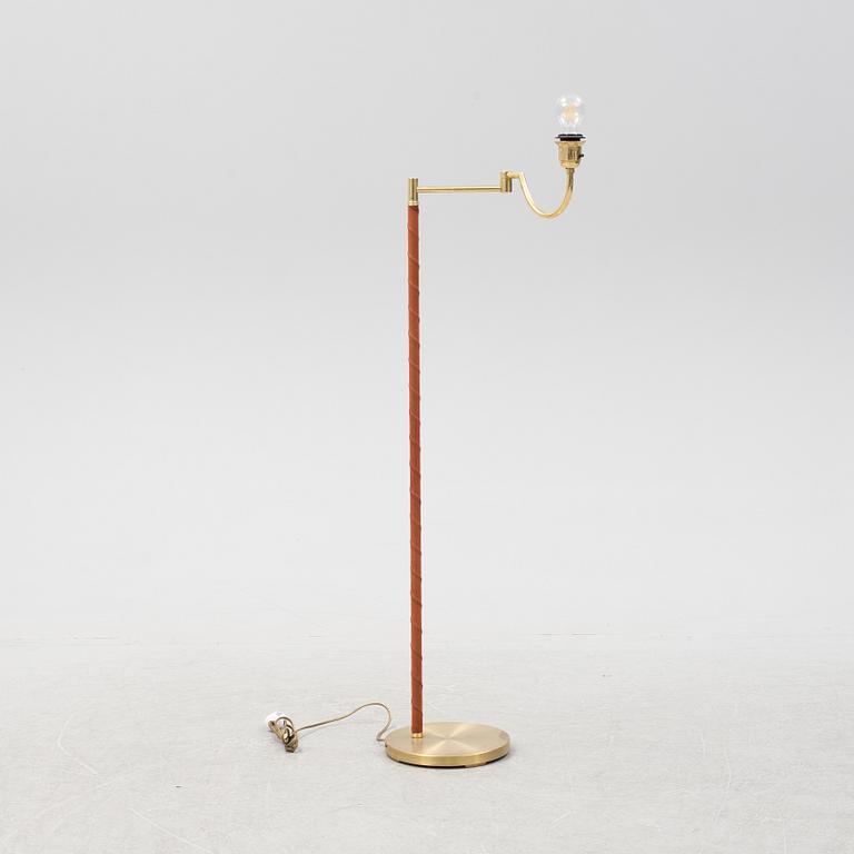 A brass floor lamp from EWÅ, second part of the 20th Century.