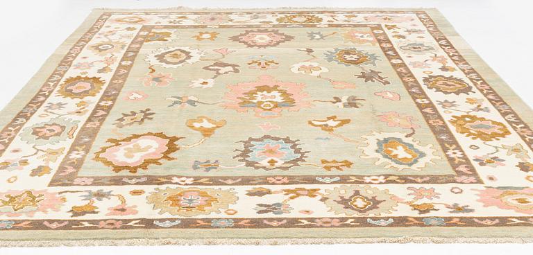 A Sultanabad/Ushak design carpet, signed Halil, c. 389 x 295 cm.