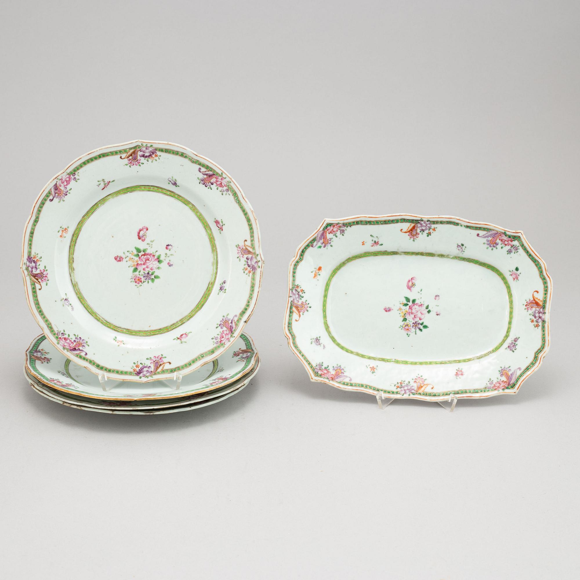 A set of four Chinese famille rose porcelain plates and one serving dish. Qing dynasty, Qianlong (1736-1795).
