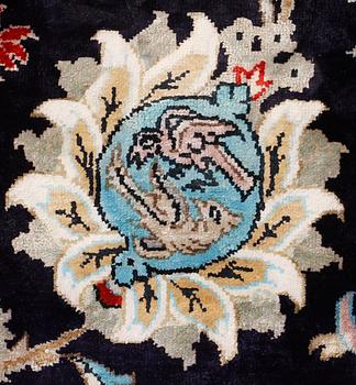 A silk Ghom carpet, 309 x 200 cm.