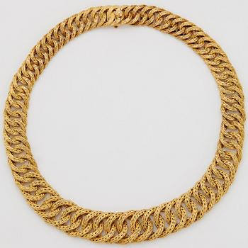 Georges L'Enfant an 18K gold demi parure comprising a necklace, a bracelet and a ring.