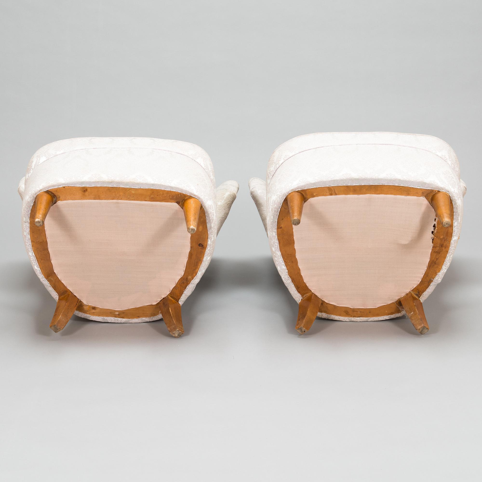 A pair of 1950's armchairs.