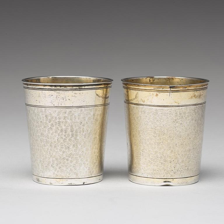 A matched pair of German 17th century parcel-gilt silver, Augsburg (1627-1665).