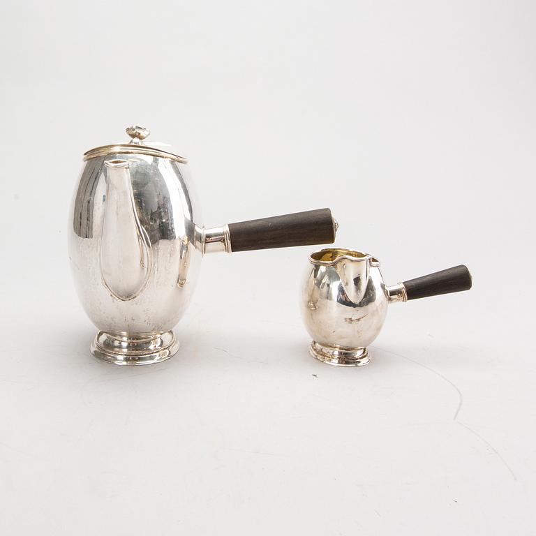 A Swedish 20th century silver coffee pot and creamer, mark of GAB Stockholm 1946 and 1948.