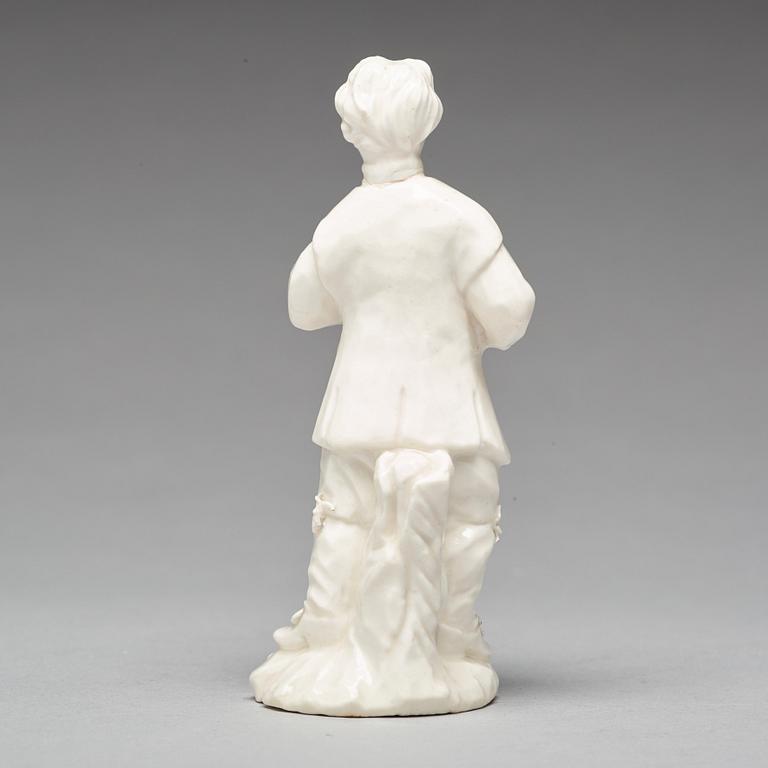 A Swedish Marieberg soft paste figure of a man with a bird, 18th Century.