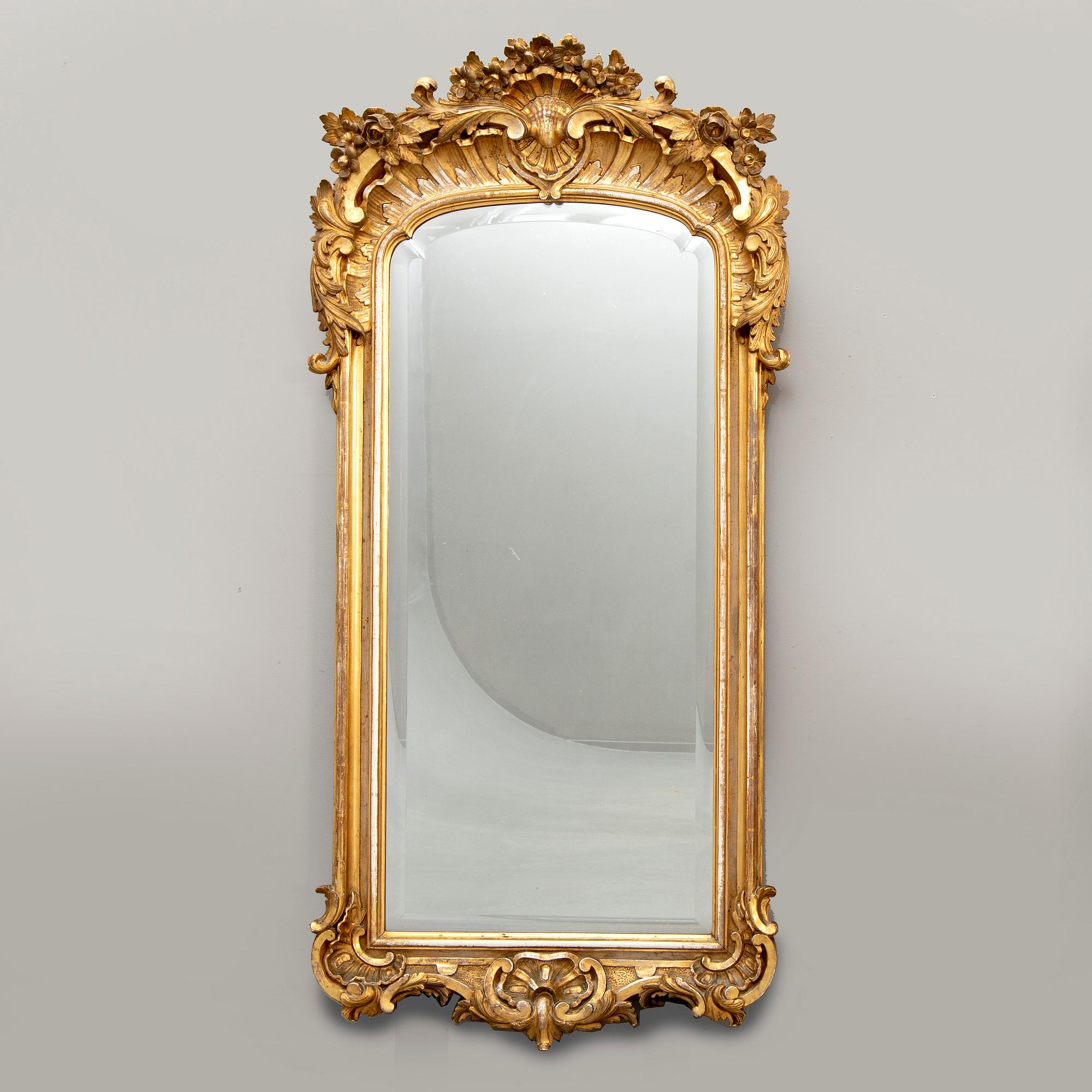 A Swedish Neo Rococo gilded signed mirror 1880s.