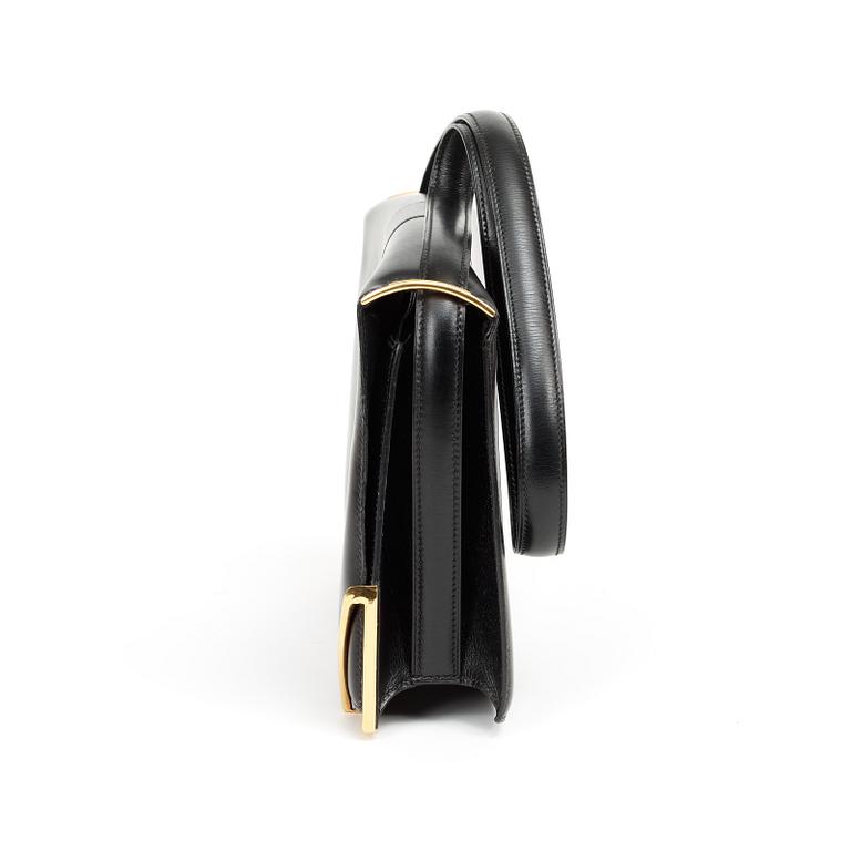A 1970s black shoulder bag by Hermès.