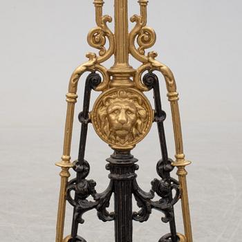 An iron umbrella stand circa 1900.