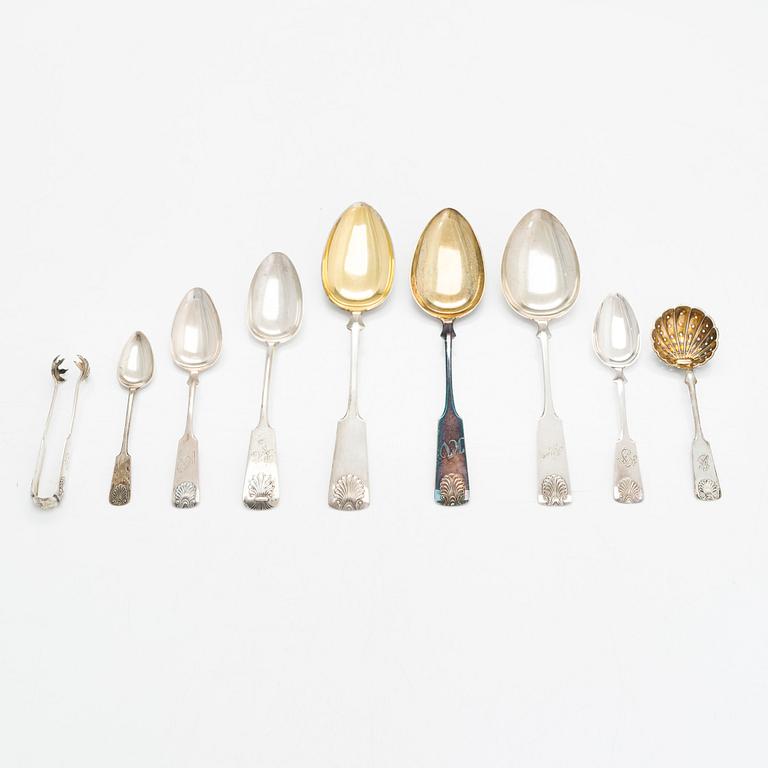 Silver spoons, 29 pcs, and sugar tongs with shell motif mostly by Kuopion Kultaseppä oy, Kuopio, 1919-53.