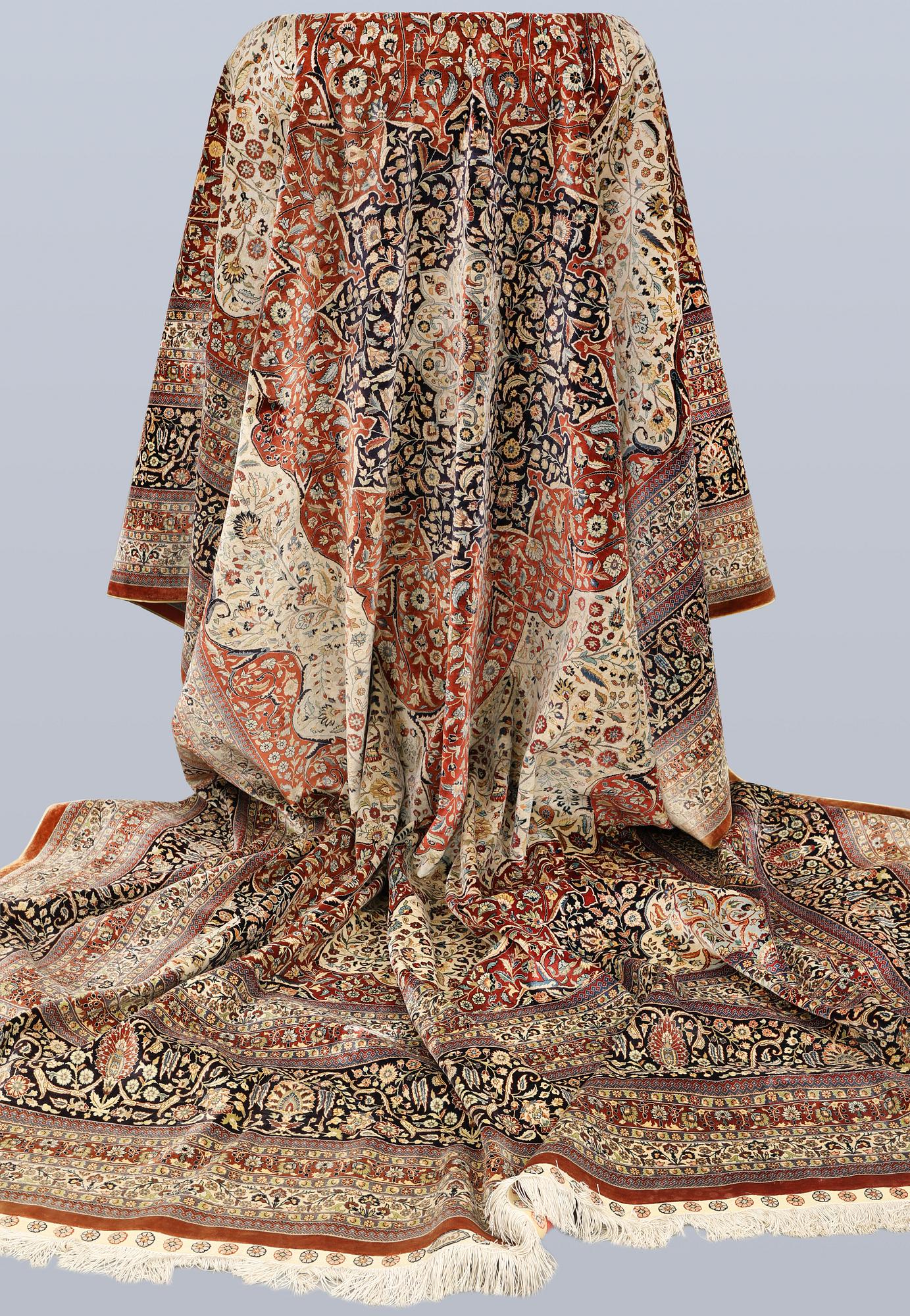 An Oriental silk carpet, c. 436 x 306 cm.