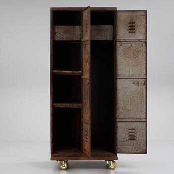 A 20th century patinated metal changing room cabinet.