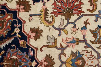 An antique Tabriz carpet, c. 365 x 280 cm.