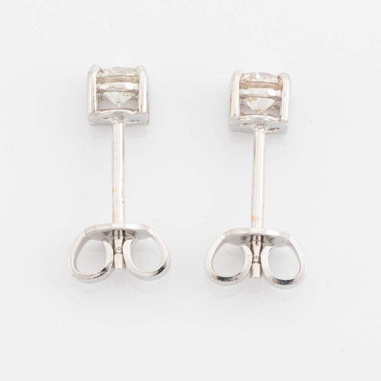 Brilliant cut diamond stud earrings.