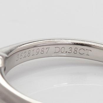 Tiffany & Co, a platinum solitaire ring with a brilliant-cut diamond.