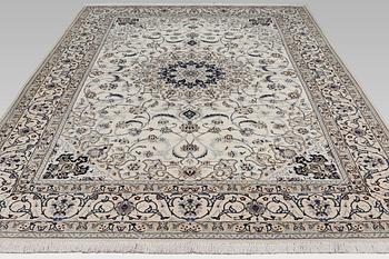 A Nain carpet, part silk, so-called 9 LAA, approx. 355 x 248 cm.