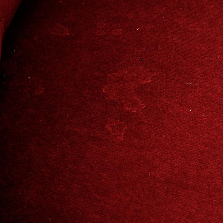 A first half of the 20th Century sofa with velvet upholstery.