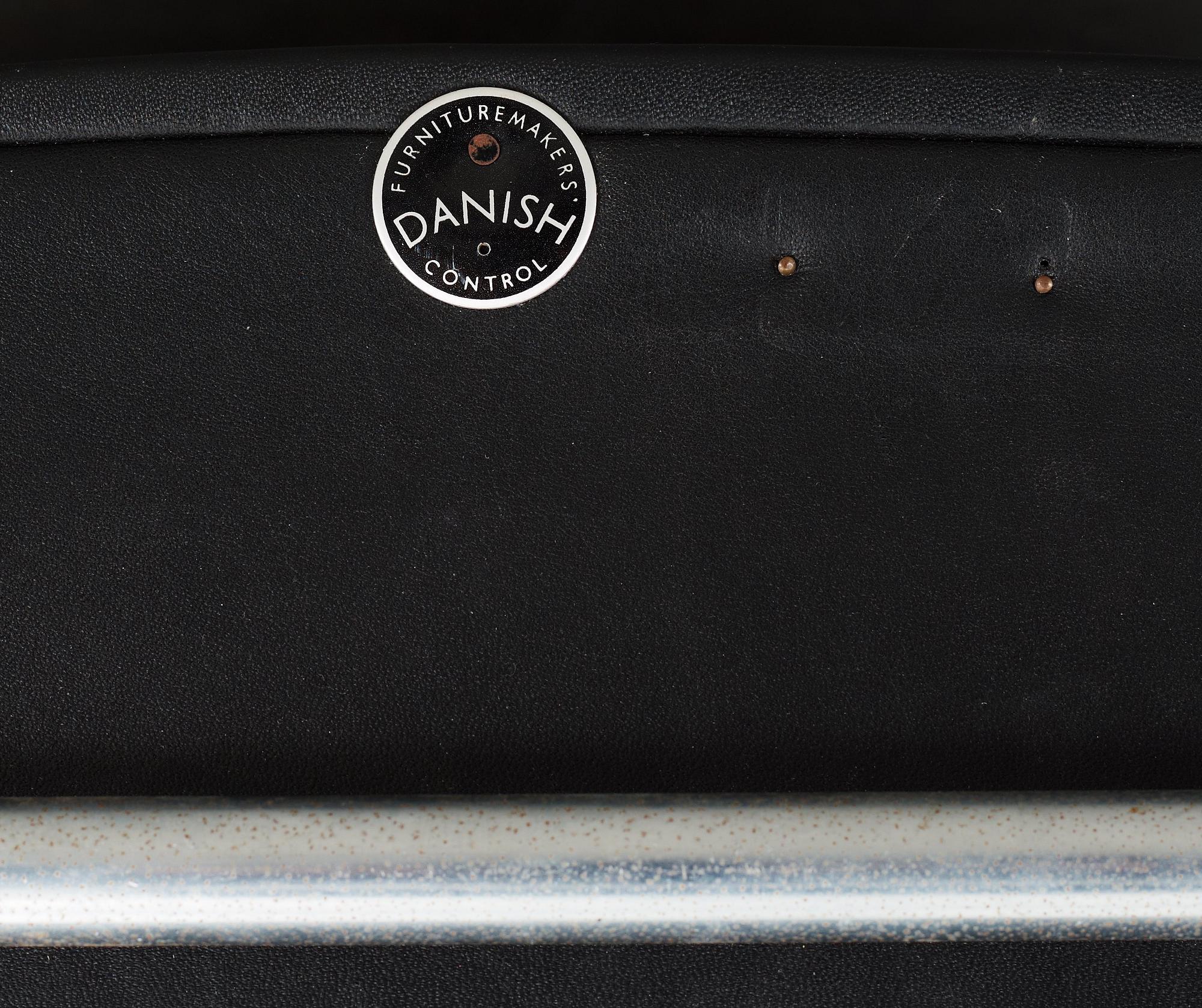 A Hans J Wegner 'Kastrup' steel and black leather chair, AP-stolen, Denmark.