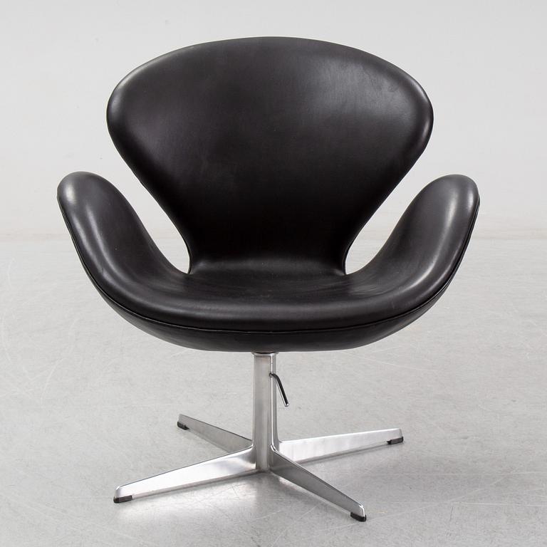 Arne Jacobsen, a black leather 'Swan' chair, Fritz Hansen, Denmark, 1967.