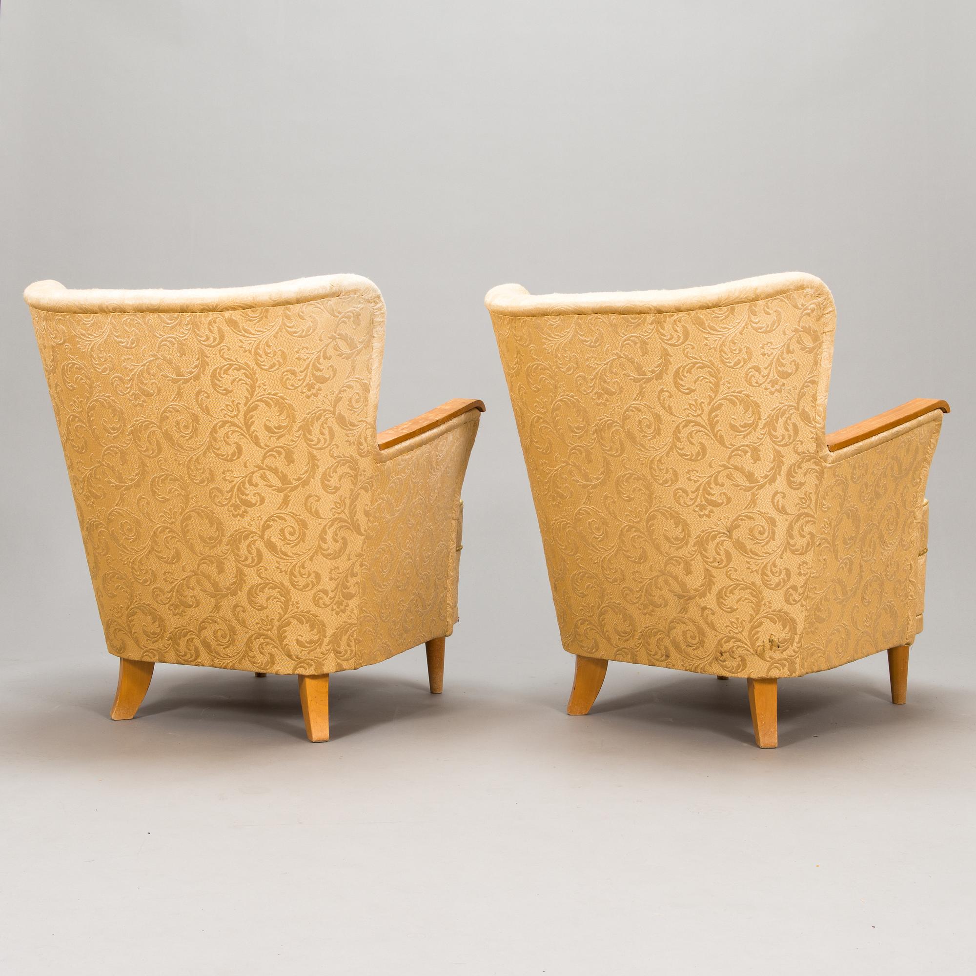 A pair of 1950's armchairs.