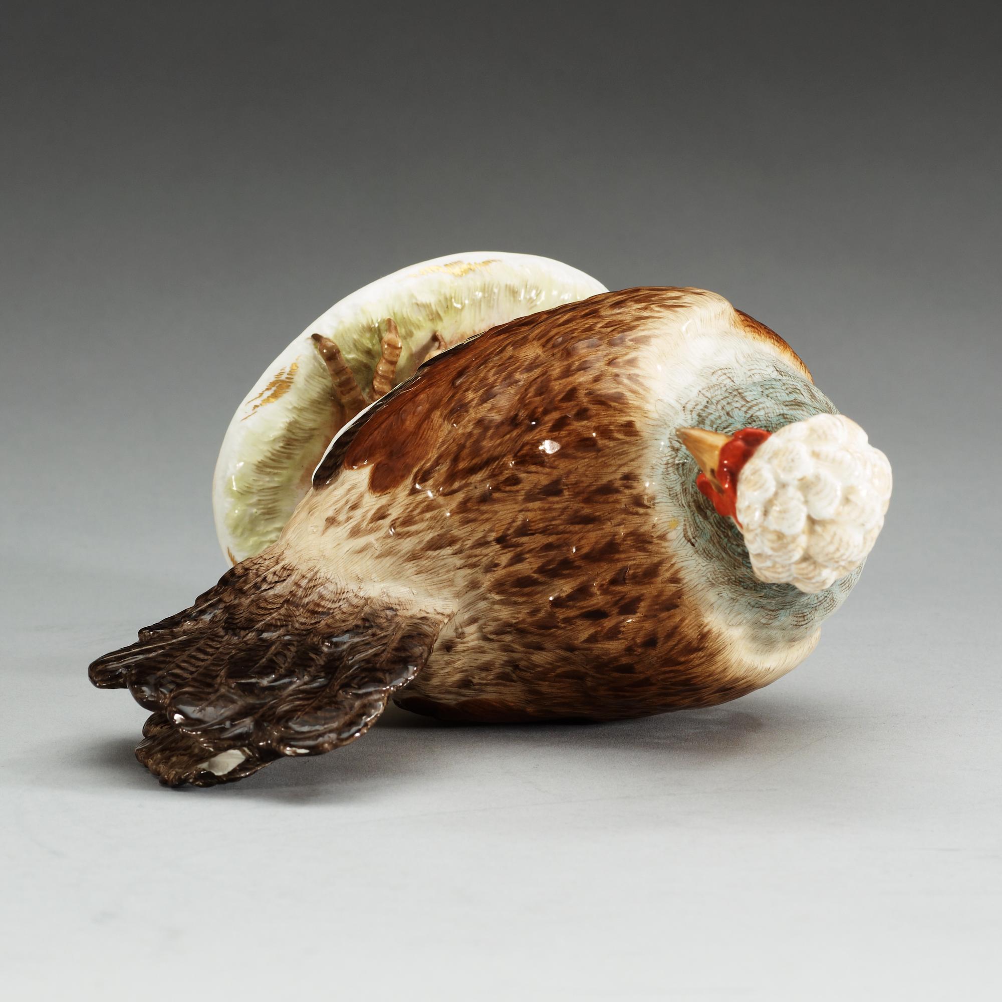 A Meissen figure of a hen with an egg, 19th Century.