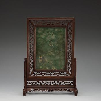 A Chinese reticulated wood table screen.