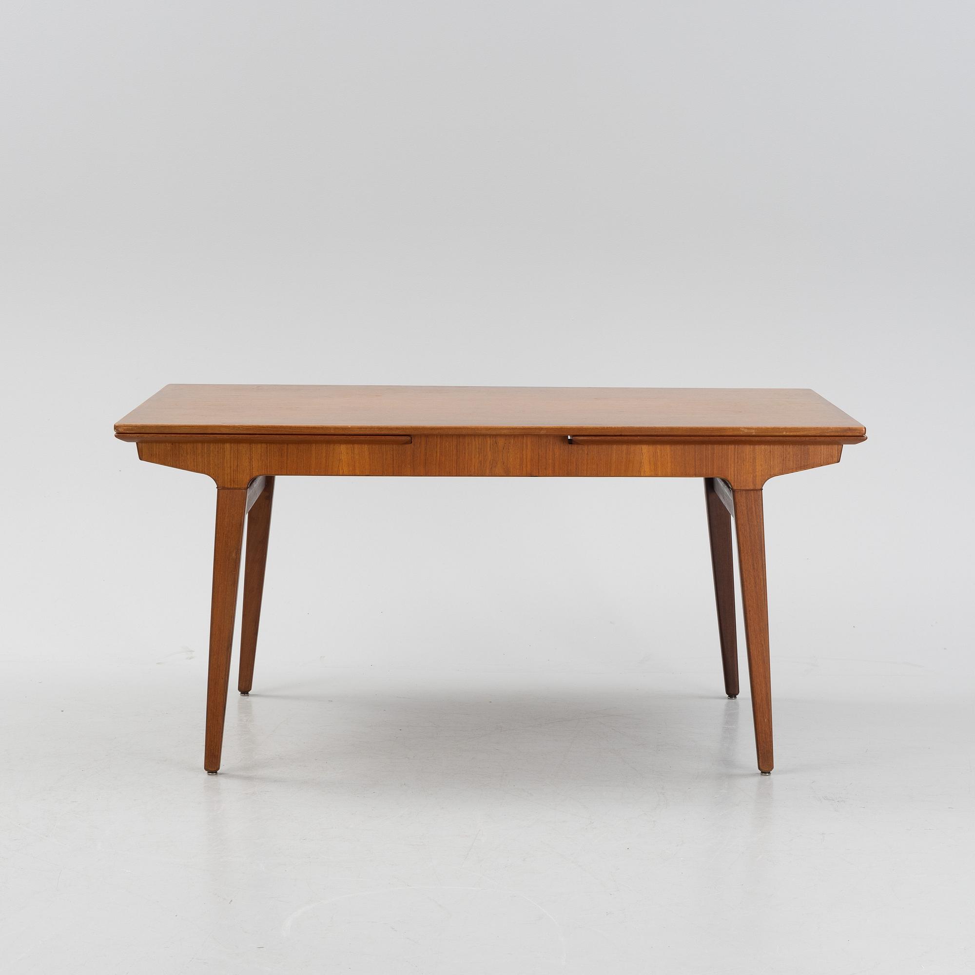 A 1960s teak veneer dining table.