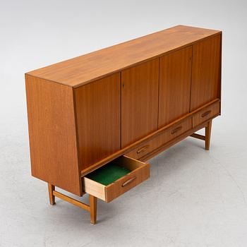 A mid20th century teak-veneered sideboard.
