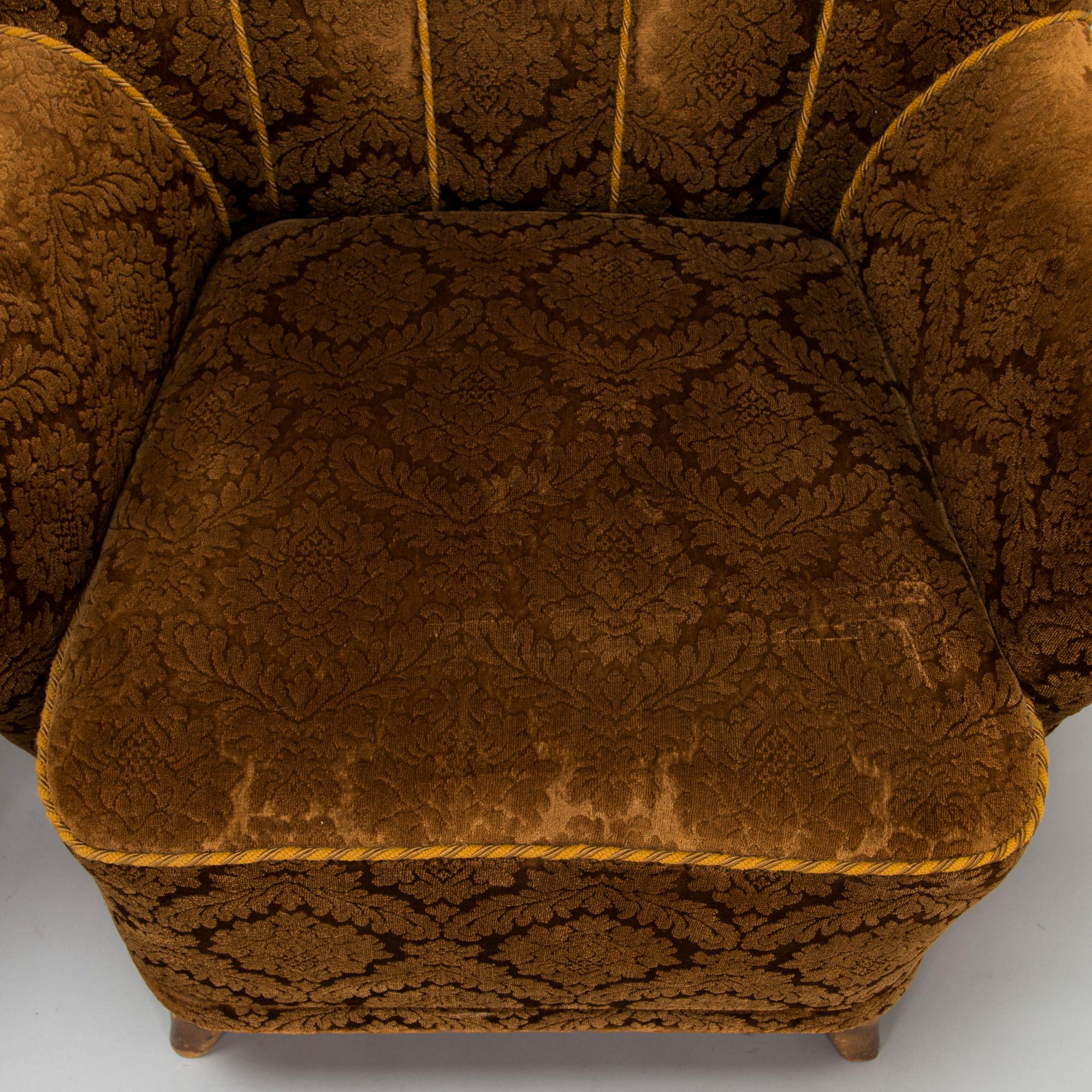 A pair of mid-20th-century armchairs.