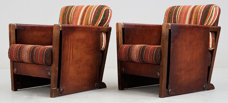 A pair of Axel Einar Hjorth brown leather 'Funkis' armchairs, Nordiska Kompaniet, Sweden ca 1930.