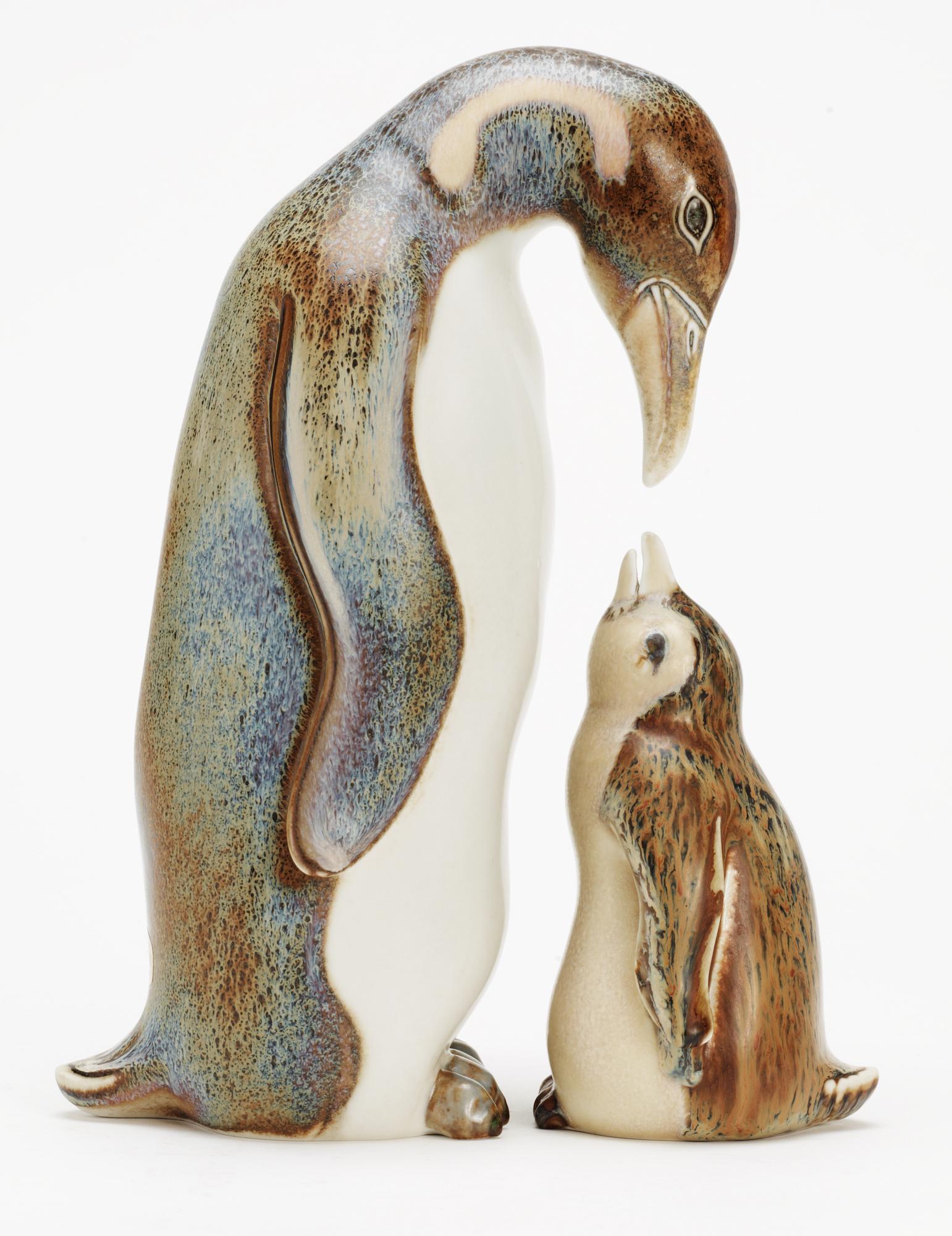 Two Gunnar Nylund stoneware figures depicting a penguin mother with child, Rörstrand.