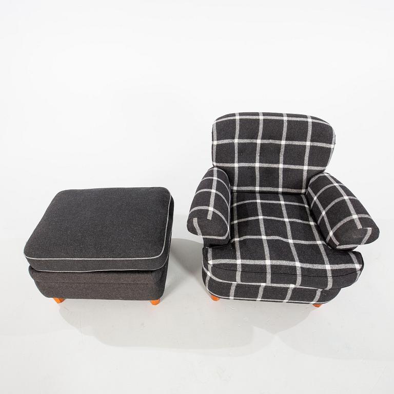 Josef Frank, a model '568' armchair and stool, Firma Svenskt Tenn, Sweden.