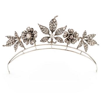 554. A silver and gold tiara with old-cut and rose-cut diamonds.