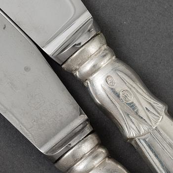 A set of 12 silver and steel knives, model Lotus, Denmark. 20th century.