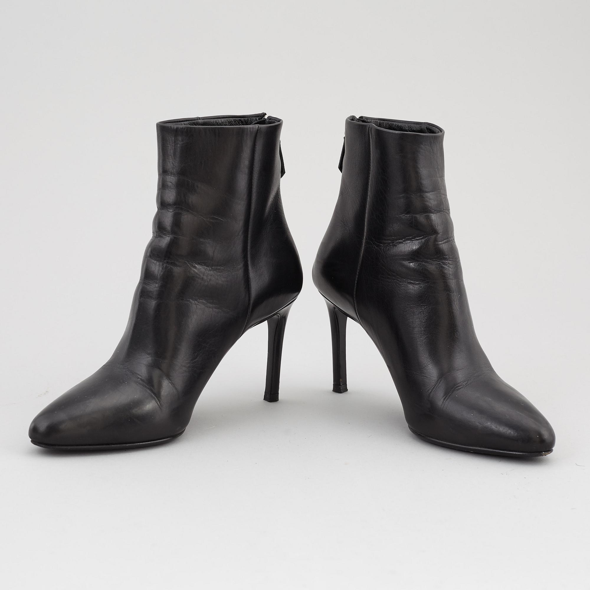 PRADA, a pair of black leather boots, size 35.