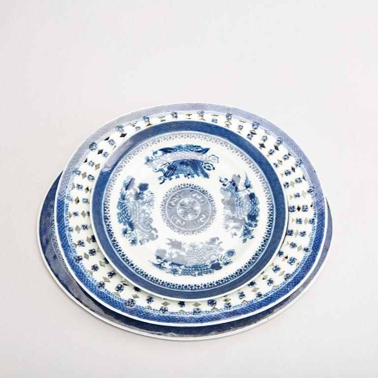 A set of two Chinese blue and white 18th century plates and strainer.