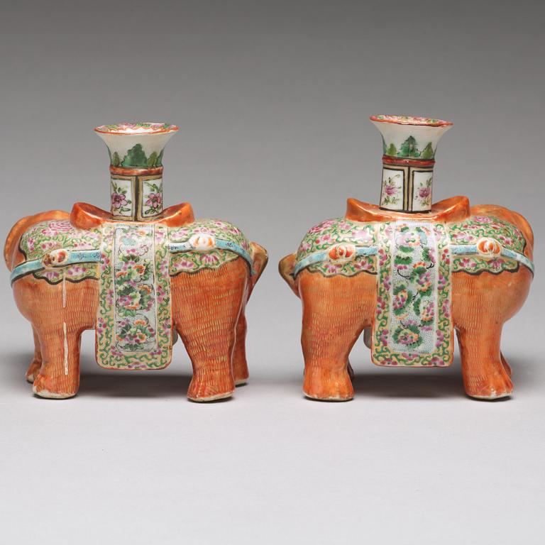 A pair of famille rose Canton elephant candle holders, late Qing dynasty, about 1900.