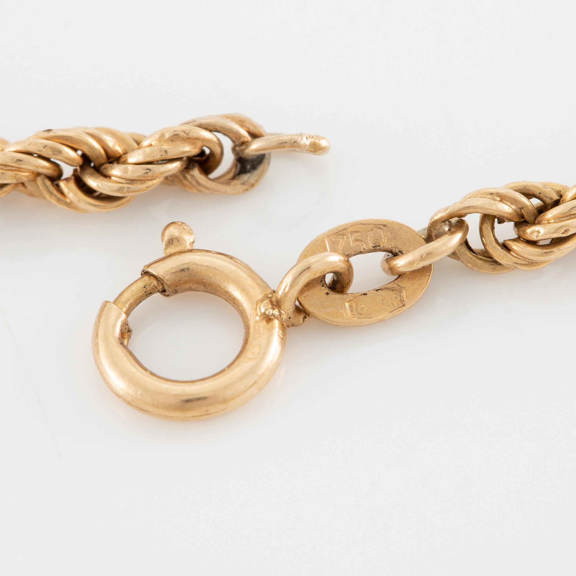 Necklace and bracelet in with floral motif set with cabochon-cut emeralds and rose-cut diamonds.