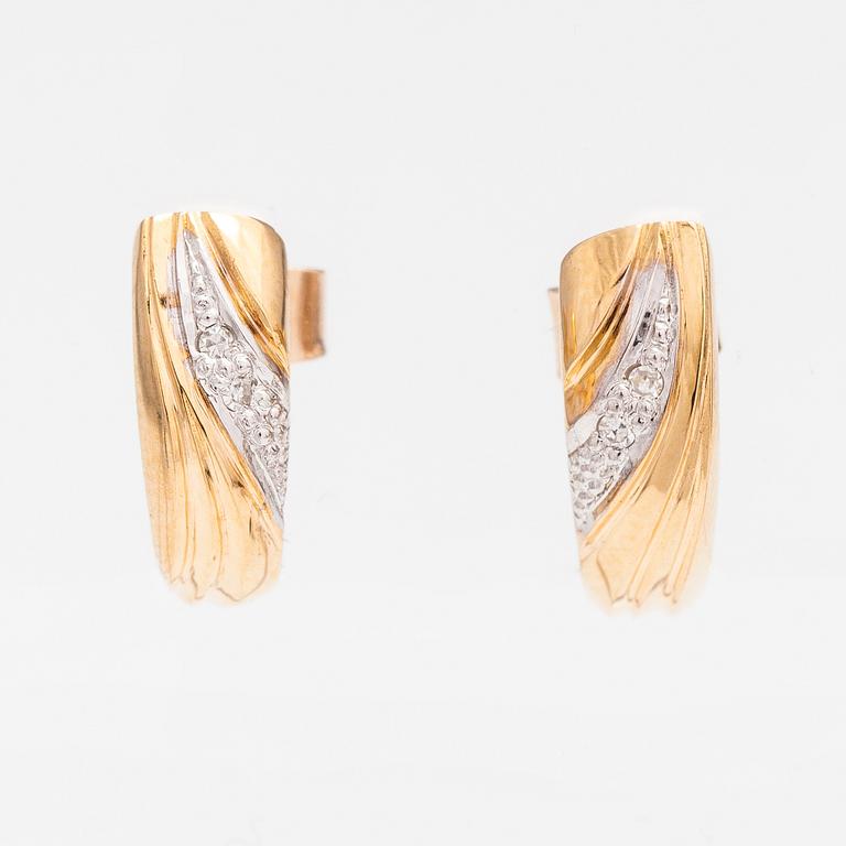 A pair of 14K ogld earrings with diaomnds ca. 0.036 ct in total. Finland 1992.
