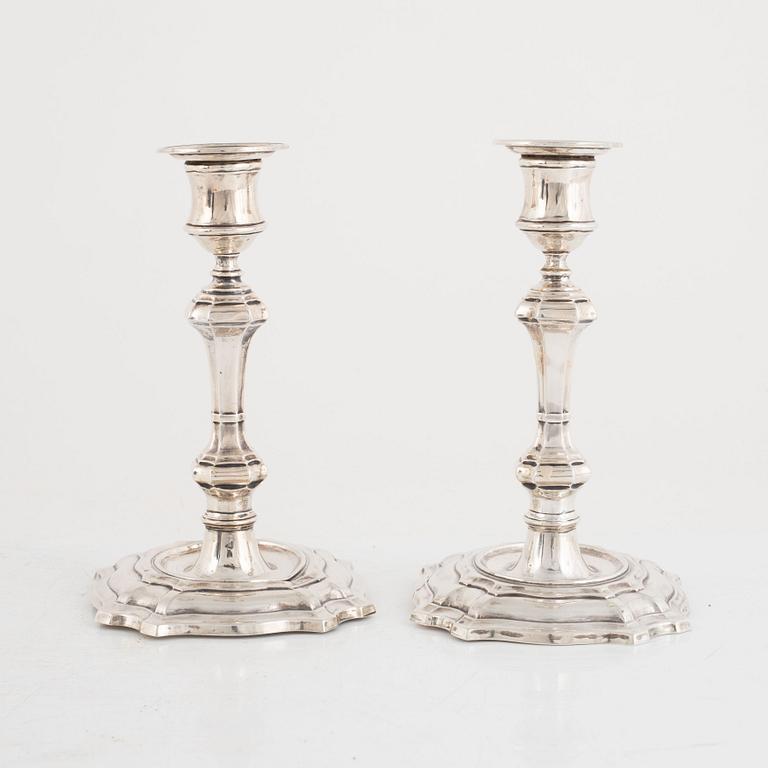 A pair of silver candlesticks, makr of William Hutton & Sons Ltd, London, 1900.