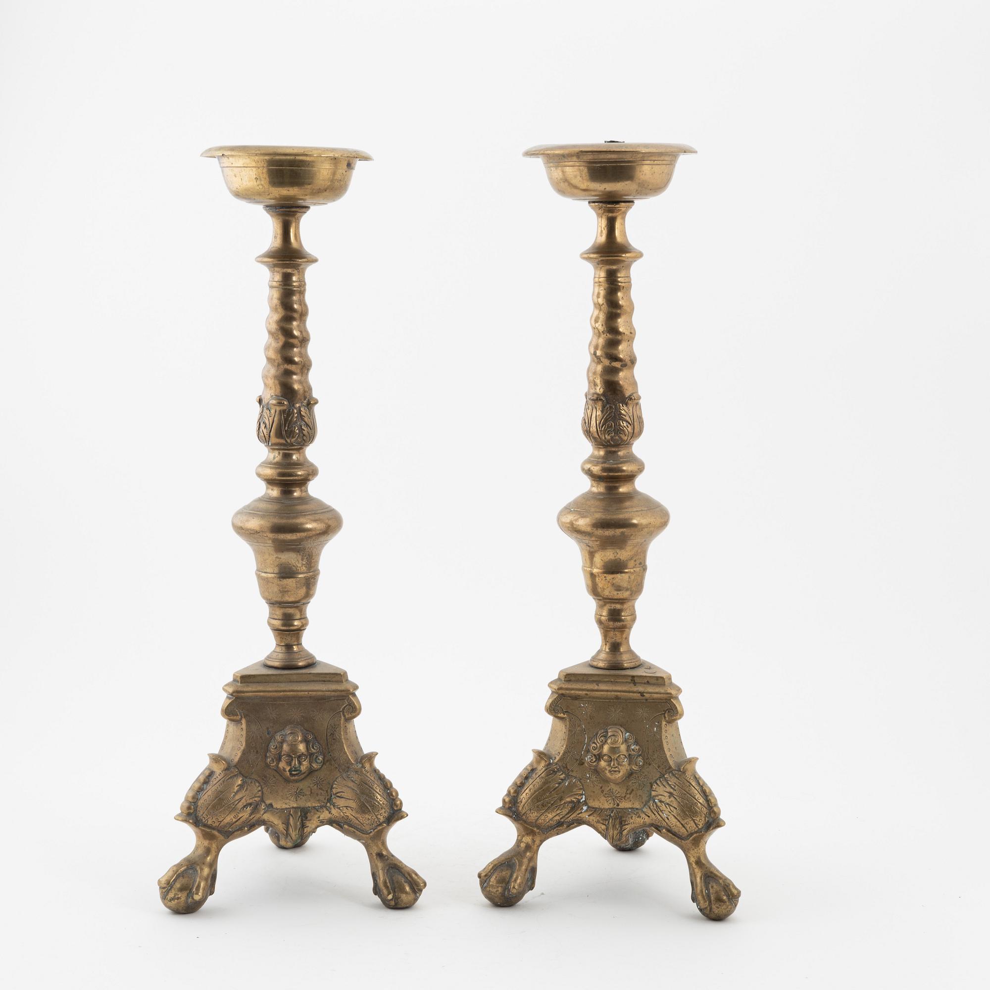 A pair of Baroque-style bronze candlesticks, 19th Century.