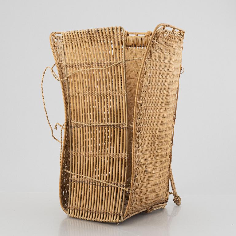 An Indonesian woven rattan backpack, 20th century.