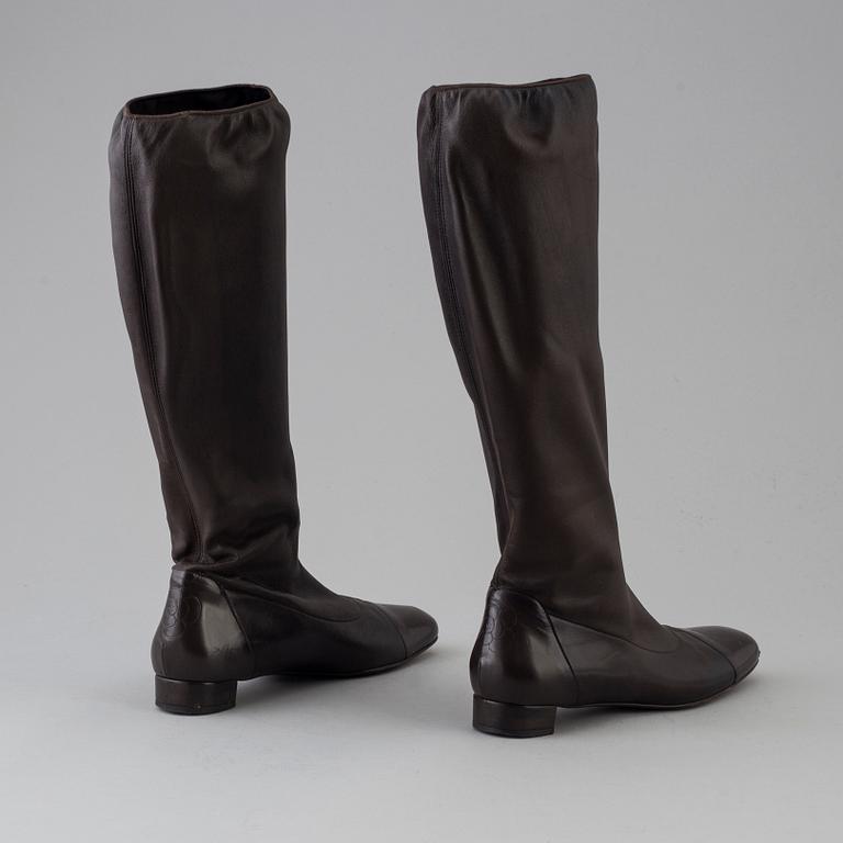 Brown leather boots by Chanel.