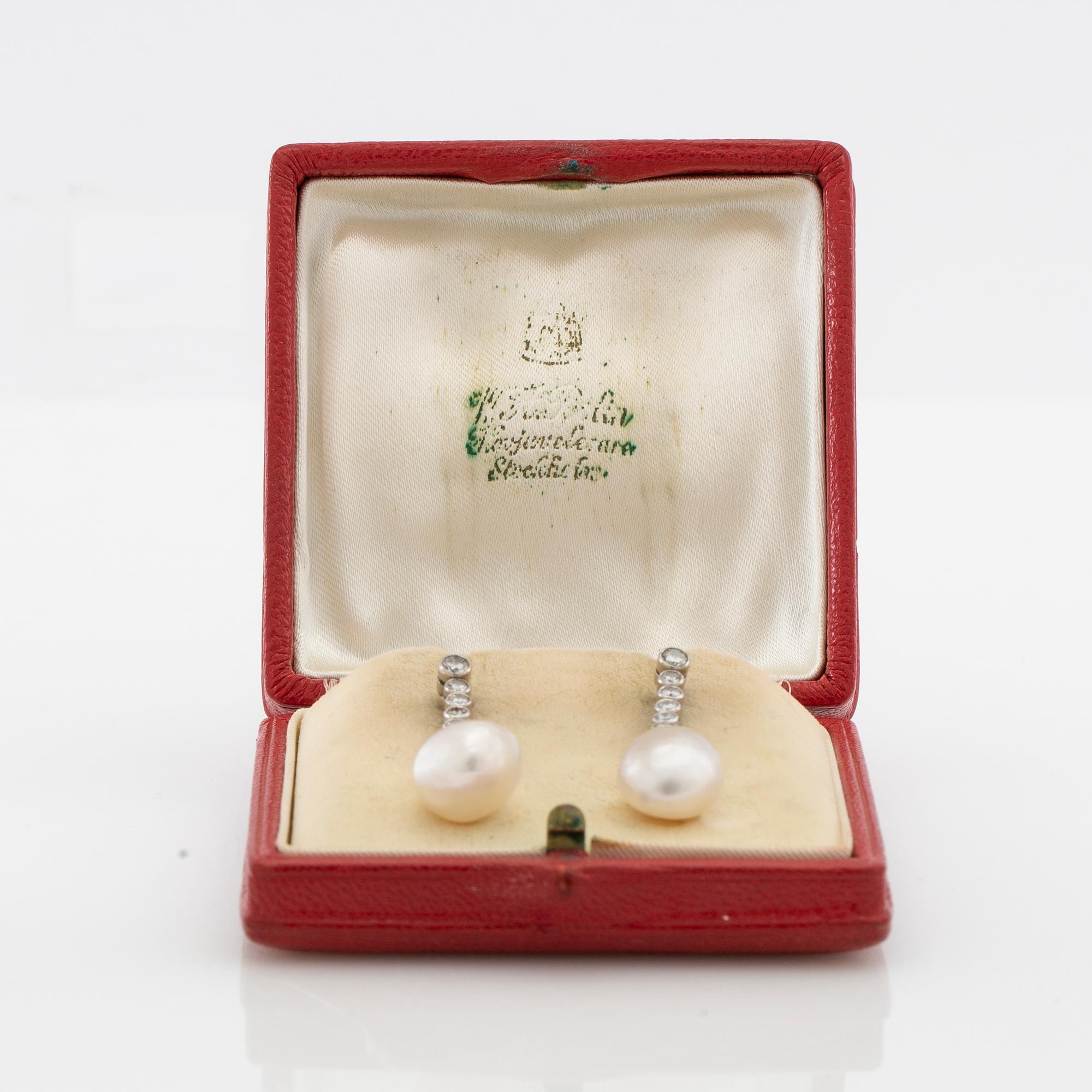 Earrings, a pair of 18K white gold with diamonds and cultured drop-shaped pearls.