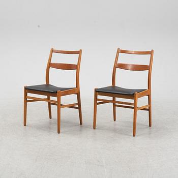 A five-piece teak and oak dining suite, second half of the 20th Century.