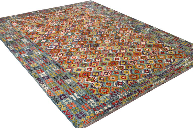 An Afghan kelim carpet, c. 397 x 308 cm.