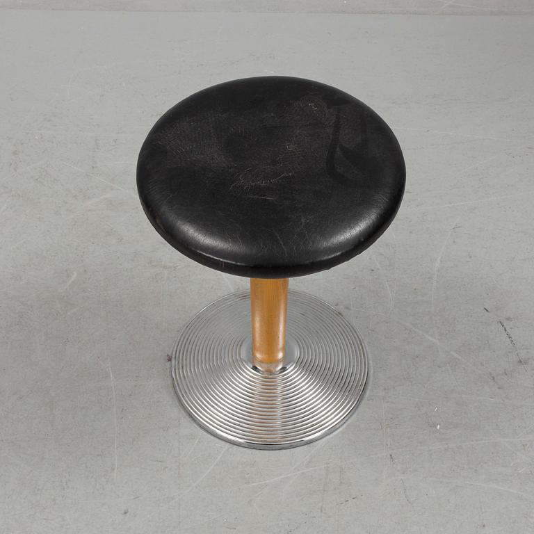 A mid 20th century stool with crome foot and leather coated seat.