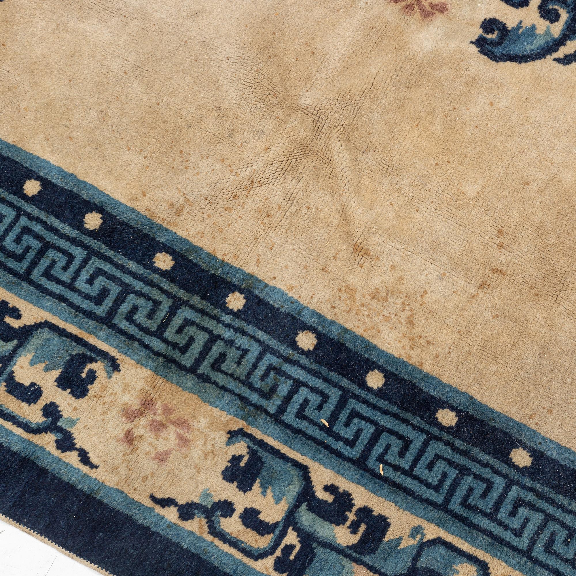 A Chinese Antique Finish rug, c. 278 x 186 cm.
